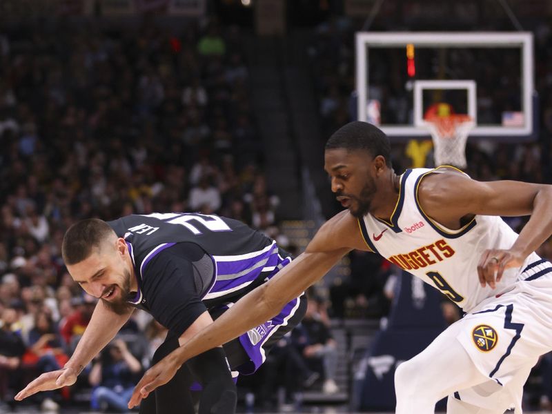 DENVER, COLORADO - FEBRUARY 28: Alex Len #25 of the Sacramento Kings and Justin Holiday #9 of the Denver Nuggets compete for the ball during the game at Ball Arena on February 28, 2024 in Denver, Colorado. NOTE TO USER: User expressly acknowledges and agrees that, by downloading and or using this photograph, User is consenting to the terms and conditions of the Getty Images License Agreement. (Photo by Alysa Rubin/Clarkson Creative/Getty Images)