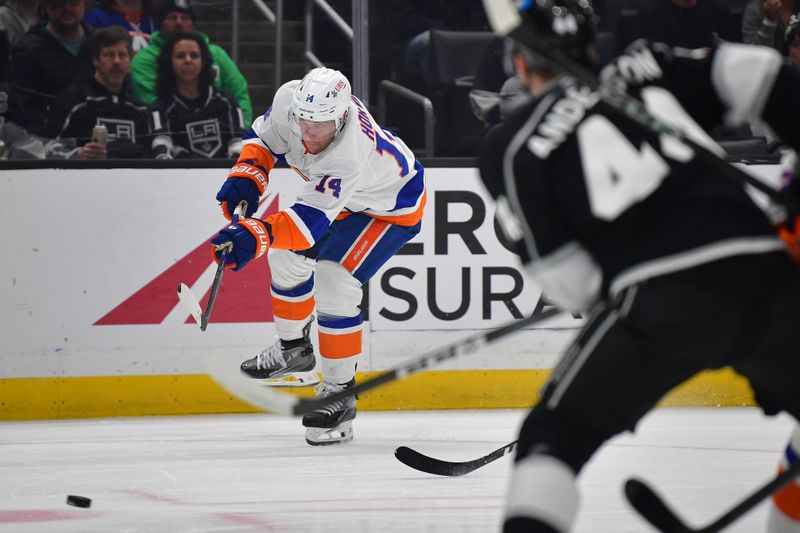 Mar 11, 2024; Los Angeles, California, USA; New York Islanders center Bo Horvat (14) shoots on goal against the Los Angeles Kings during the first period at Crypto.com Arena. Mandatory Credit: Gary A. Vasquez-USA TODAY Sports