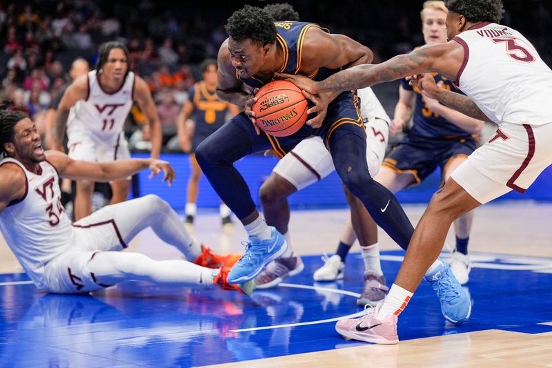 Mar 11, 2025; Charlotte, NC, USA; California Golden Bears center Mady Sissoko (12) scrambles for the loose ball under the basket against the Virginia Tech Hokies during the first half at Spectrum Center. Mandatory Credit: Jim Dedmon-Imagn Images