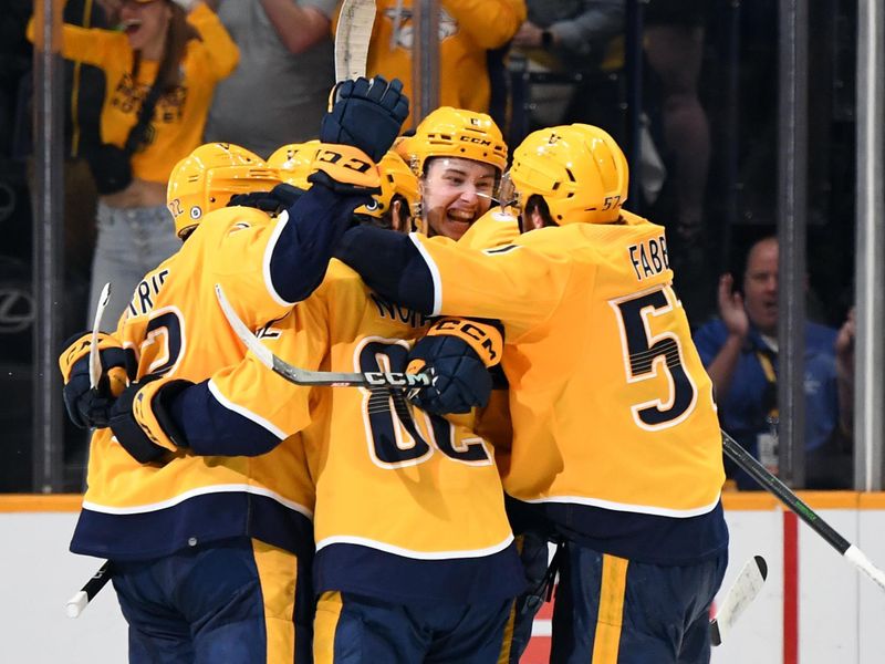 Apr 4, 2023; Nashville, Tennessee, USA; Nashville Predators center Cody Glass (8) celebrates with teammates after scoring the game-winning goal to beat the Vegas Golden Knights at Bridgestone Arena. Mandatory Credit: Christopher Hanewinckel-USA TODAY Sports