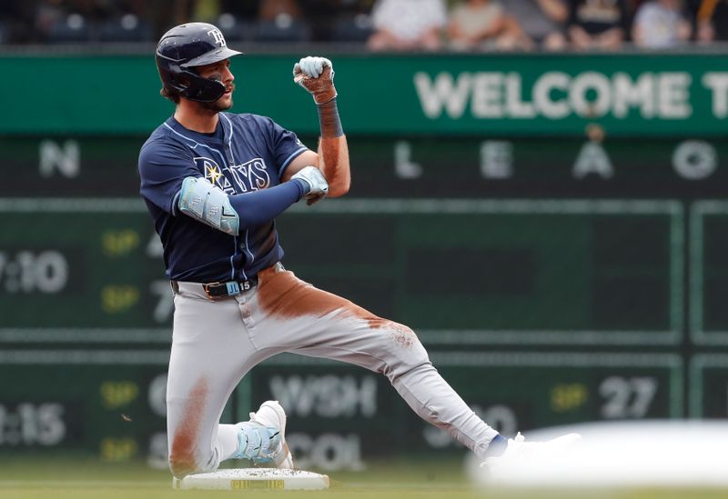 Jun 23, 2024; Pittsburgh, Pennsylvania, USA;  Tampa Bay Rays designated hitter Josh Lowe (15) reacts at second base with a double against the Pittsburgh Pirates during the first inning at PNC Park. Mandatory Credit: Charles LeClaire-USA TODAY Sports