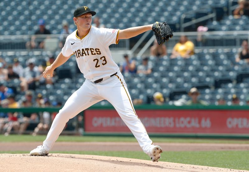 Jul 8, 2024; Pittsburgh, Pennsylvania, USA;  Pittsburgh Pirates starting pitcher Mitch Keller (23) delivers a pitch against the New York Mets during the first inning at PNC Park. Mandatory Credit: Charles LeClaire-USA TODAY Sports