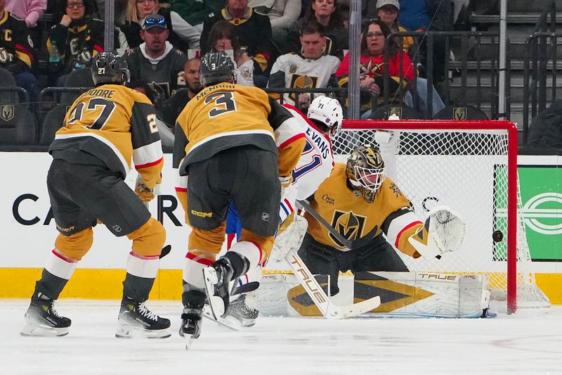 Nov 28, 2025; Las Vegas, Nevada, USA; Montréal Canadiens center Jake Evans (71) scores a goal against Vegas Golden Knights goaltender Akira Schmid (40) during the third period at T-Mobile Arena. Mandatory Credit: Stephen R. Sylvanie-Imagn Images