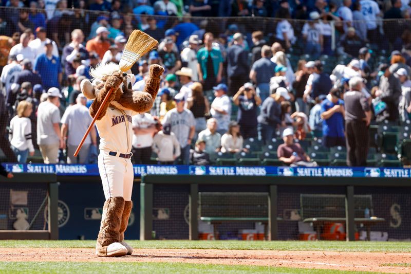 Jun 16, 2024; Seattle, Washington, USA; Seattle Mariners mascot Moose celebrates a 5-0 victory against the Texas Rangers, completing a three-game series sweep at T-Mobile Park. Mandatory Credit: Joe Nicholson-USA TODAY Sports