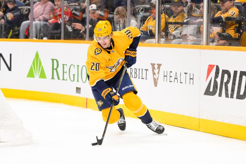 Jan 16, 2025; Nashville, Tennessee, USA;  Nashville Predators defenseman Justin Barron (20) skates behind the net against the Chicago Blackhawks during the third period at Bridgestone Arena. Mandatory Credit: Steve Roberts-Imagn Images