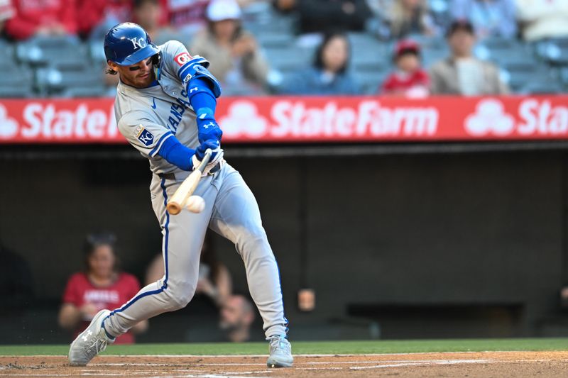 May 11, 2024; Anaheim, California, USA; Kansas City Royals shortstop Bobby Witt Jr. (7) hits a single against the Los Angeles Angels during the first inning at Angel Stadium. Mandatory Credit: Jonathan Hui-USA TODAY Sports