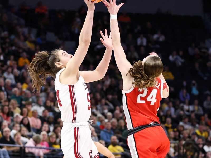 Mar 4, 2023; Minneapolis, MINN, USA; Indiana Hoosiers forward Mackenzie Holmes (54) and Ohio State Buckeyes guard Taylor Mikesell (24) jump for the ball during the second half at Target Center. Mandatory Credit: Matt Krohn-USA TODAY Sports