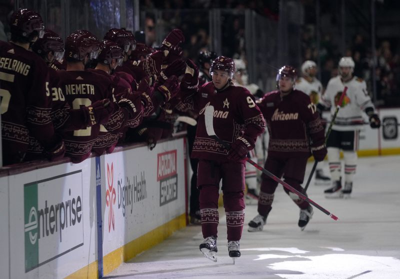 Mar 18, 2023; Tempe, Arizona, USA; Arizona Coyotes right wing Clayton Keller (9) celebrates his goal against the Chicago Blackhawks during the third period at Mullett Arena. Mandatory Credit: Joe Camporeale-USA TODAY Sports