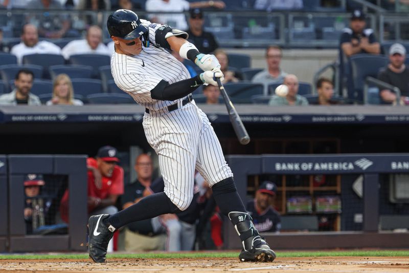 Aug 23, 2023; Bronx, New York, USA; New York Yankees right fielder Aaron Judge (99) hits a solo home run during the first inning against the Washington Nationals at Yankee Stadium. Mandatory Credit: Vincent Carchietta-USA TODAY Sports