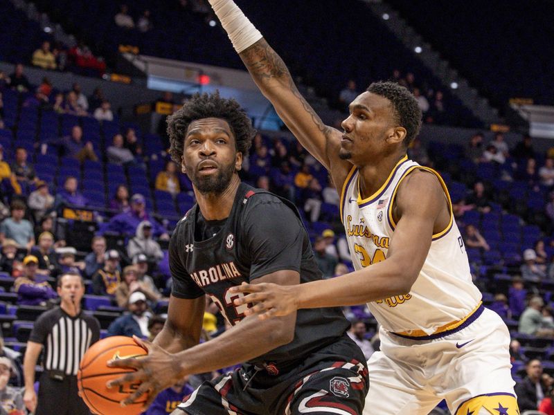 Feb 18, 2023; Baton Rouge, Louisiana, USA; South Carolina Gamecocks forward Josh Gray (33) drives to the basket against LSU Tigers forward Shawn Phillips (34) during the second half at Pete Maravich Assembly Center. Mandatory Credit: Stephen Lew-USA TODAY Sports