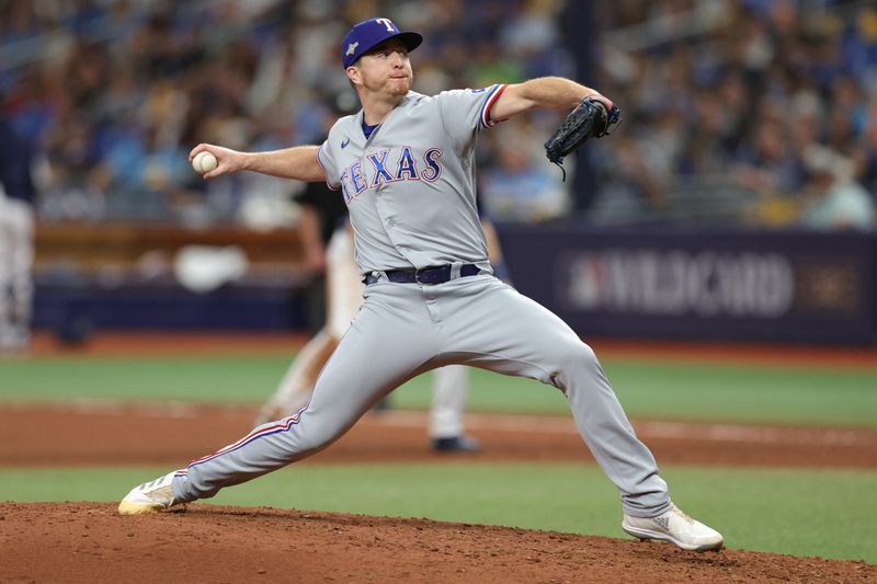 Oct 4, 2023; St. Petersburg, Florida, USA; Texas Rangers relief pitcher Josh Sborz (66) pitches against the Tampa Bay Rays in the seventh inning during game two of the Wildcard series for the 2023 MLB playoffs at Tropicana Field. Mandatory Credit: Nathan Ray Seebeck-USA TODAY Sports