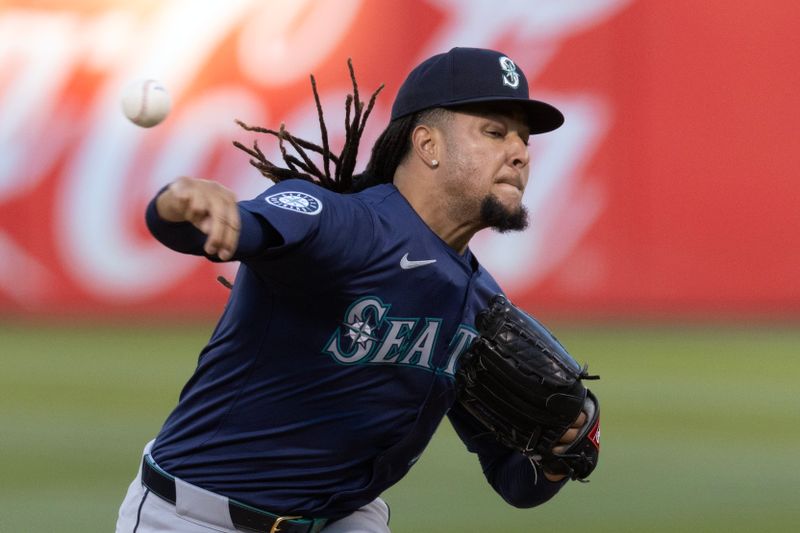 Sep 3, 2024; Oakland, California, USA; Seattle Mariners starting pitcher Luis Castillo (58) delivers a pitch against the Oakland Athletics during the first inning at Oakland-Alameda County Coliseum. Mandatory Credit: D. Ross Cameron-Imagn Images