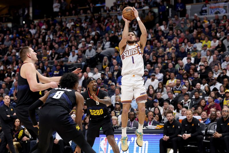 DENVER, COLORADO - MARCH 27: Devin Booker #1 of the Phoenix Suns puts up a shot against Nikola Jokic #15, Peyton Watson #8 and Kentavious Caldwell-Pope #5 of the Denver Nuggets during the first quarter at Ball Arena on March 27, 2024 in Denver, Colorado. NOTE TO USER: User expressly acknowledges and agrees that, by downloading and or using this photograph, User is consenting to the terms and conditions of the Getty Images License Agreement.  (Photo by Matthew Stockman/Getty Images)