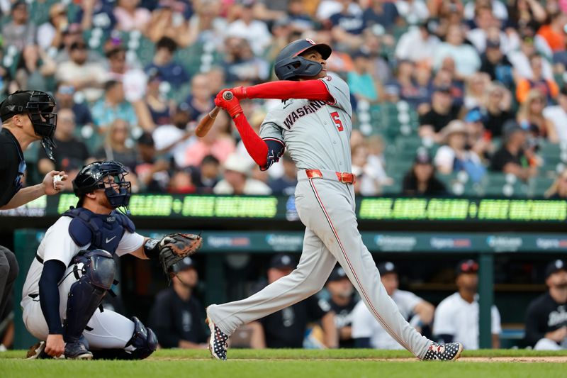 Jun 12, 2024; Detroit, Michigan, USA;  Washington Nationals shortstop CJ Abrams (5) hits a home run in the third inning against the Detroit Tigers at Comerica Park. Mandatory Credit: Rick Osentoski-USA TODAY Sports