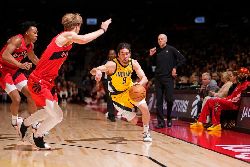 TORONTO, CANADA - FEBRUARY 14: T.J. McConnell #9 of the Indiana Pacers handles the ball during the game against the Toronto Raptors on February 14, 2024 at the Scotiabank Arena in Toronto, Ontario, Canada.  NOTE TO USER: User expressly acknowledges and agrees that, by downloading and or using this Photograph, user is consenting to the terms and conditions of the Getty Images License Agreement.  Mandatory Copyright Notice: Copyright 2024 NBAE (Photo by Mark Blinch/NBAE via Getty Images)