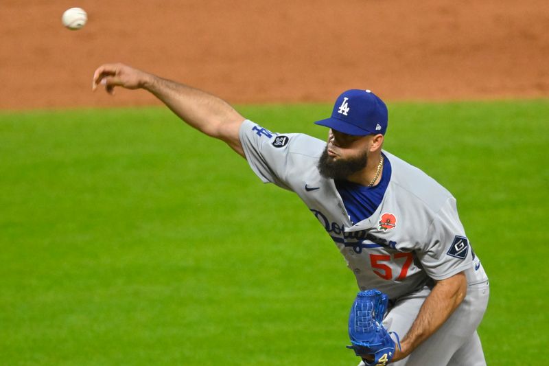 May 26, 2025; Cleveland, Ohio, USA; Los Angeles Dodgers relief pitcher Luis Garcia (57) delivers a pitch in the ninth inning against the Cleveland Guardians at Progressive Field. Mandatory Credit: David Richard-Imagn Images