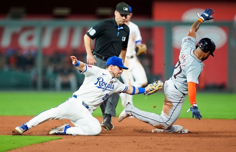 Sep 17, 2024; Kansas City, Missouri, USA; Detroit Tigers third baseman Andy Ibanez (77) is caught stealing by Kansas City Royals second baseman Michael Massey (19) during the fifth inning at Kauffman Stadium. Mandatory Credit: Jay Biggerstaff-Imagn Images