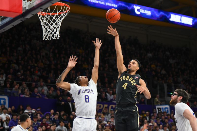 Jan 15, 2025; Seattle, Washington, USA; Purdue Boilermakers forward Trey Kaufman-Renn (4) shoots the ball over Washington Huskies guard Tyler Harris (8) during the first half at Alaska Airlines Arena at Hec Edmundson Pavilion. Mandatory Credit: Steven Bisig-Imagn Images