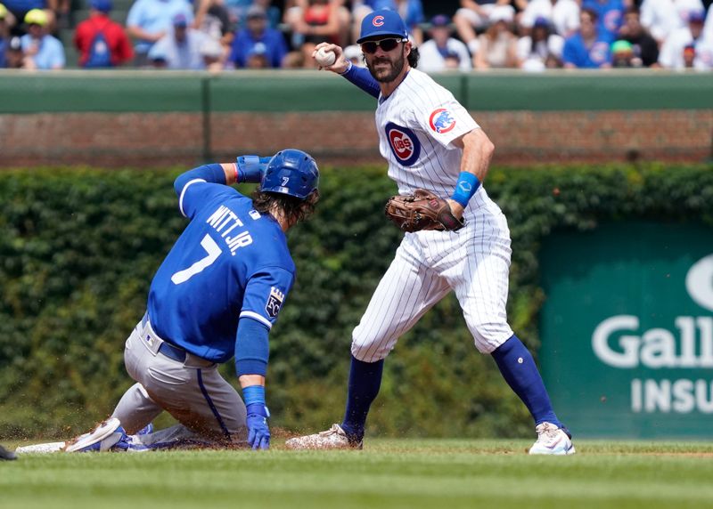 Aug 19, 2023; Chicago, Illinois, USA; Chicago Cubs shortstop Dansby Swanson (7) forces out Kansas City Royals shortstop Bobby Witt Jr. (7) at second base during the first inning at Wrigley Field. Mandatory Credit: David Banks-USA TODAY Sports