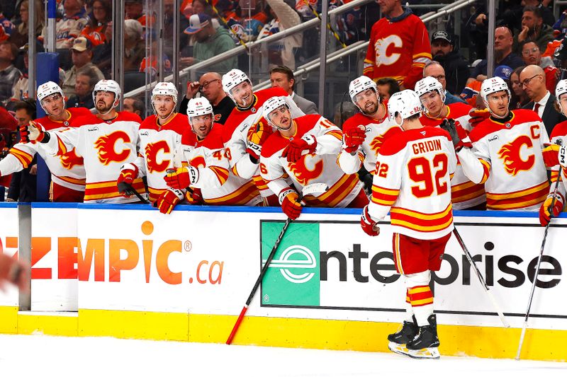 Oct 8, 2025; Edmonton, Alberta, CAN; The Calgary Flames celebrate a goal scored by defensemen Maceo Phillips (92) during the second period against the Edmonton Oilers at Rogers Place. Mandatory Credit: Perry Nelson-Imagn Images