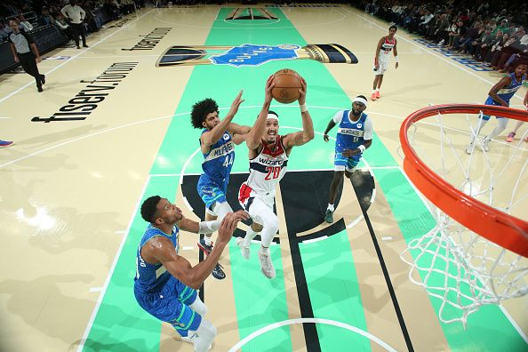 MILWAUKEE, WI - NOVEMBER 24: Landry Shamet #20 of the Washington Wizards drives to the basket during the game against the Milwaukee Bucks during the In-Season Tournament on November 24, 2023 at the Fiserv Forum Center in Milwaukee, Wisconsin. NOTE TO USER: User expressly acknowledges and agrees that, by downloading and or using this Photograph, user is consenting to the terms and conditions of the Getty Images License Agreement. Mandatory Copyright Notice: Copyright 2023 NBAE (Photo by Gary Dineen/NBAE via Getty Images).