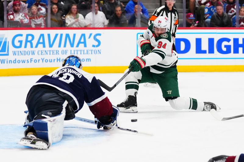 Feb 28, 2025; Denver, Colorado, USA; Colorado Avalanche goaltender Mackenzie Blackwood (39) makes a save on Minnesota Wild center Jakub Lauko (94) in the first period at Ball Arena. Mandatory Credit: Ron Chenoy-Imagn Images