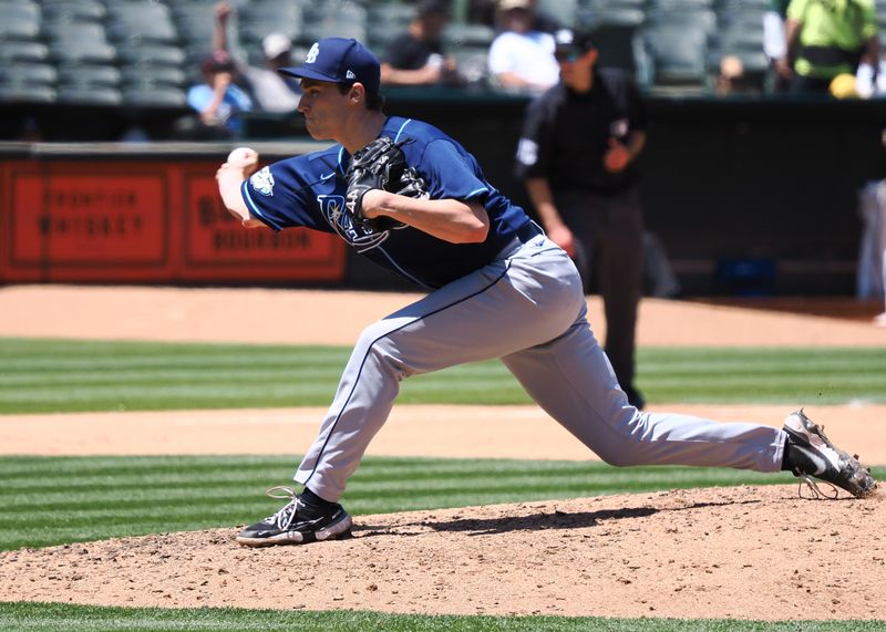 Jun 15, 2023; Oakland, California, USA; Tampa Bay Rays relief pitcher Kevin Kelly (49) pitches the ball against the Oakland Athletics during the fifth inning at Oakland-Alameda County Coliseum. Mandatory Credit: Kelley L Cox-USA TODAY Sports