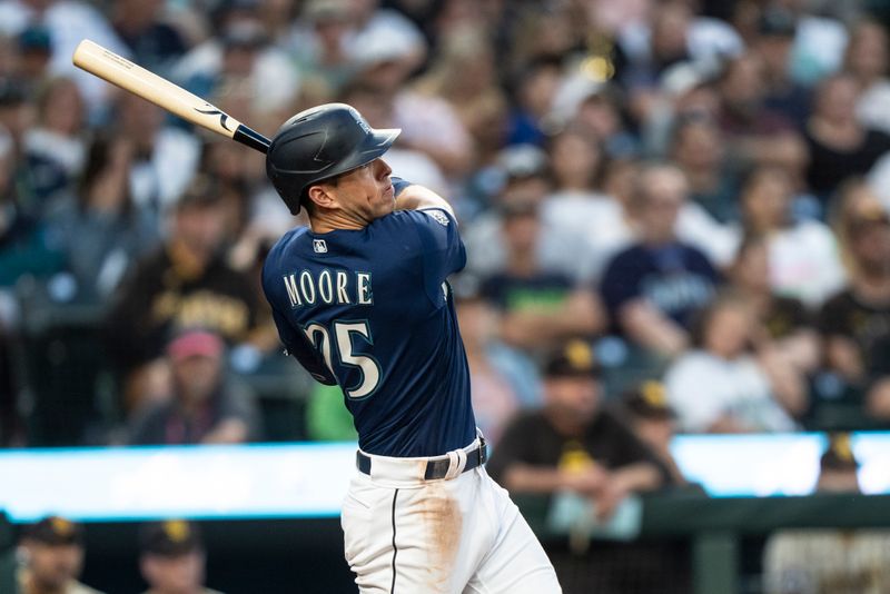 Aug 8, 2023; Seattle, Washington, USA; Seattle Mariners second baseman Dylan Moore (25) hits an RBI-triple during the sixth inning against the San Diego Padres at T-Mobile Park. Mandatory Credit: Stephen Brashear-USA TODAY Sports