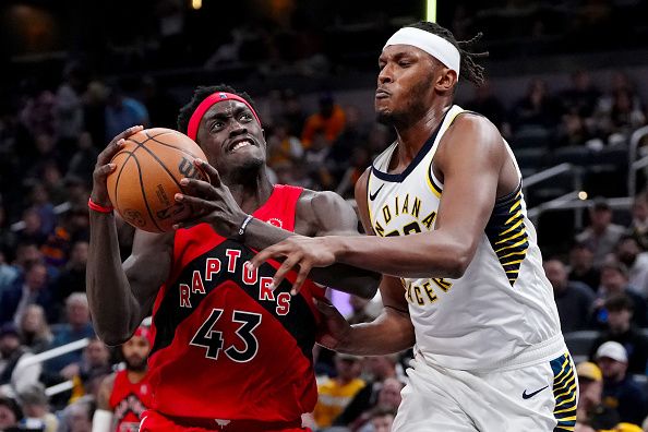 INDIANAPOLIS, INDIANA - NOVEMBER 22: Pascal Siakam #43 of the Toronto Raptors dribbles the ball while being guarded by Myles Turner #33 of the Indiana Pacers in the third quarter at Gainbridge Fieldhouse on November 22, 2023 in Indianapolis, Indiana. NOTE TO USER: User expressly acknowledges and agrees that, by downloading and or using this photograph, User is consenting to the terms and conditions of the Getty Images License Agreement. (Photo by Dylan Buell/Getty Images)