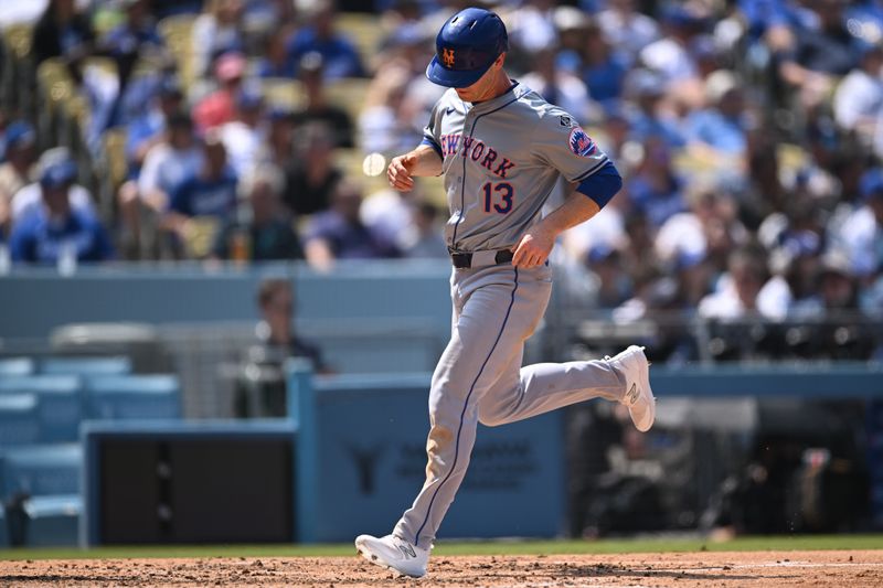 Apr 20, 2024; Los Angeles, California, USA; New York Mets third baseman Joey Wendle (13) runs home against the Los Angeles Dodgers during the fourth inning at Dodger Stadium. Mandatory Credit: Jonathan Hui-USA TODAY Sports