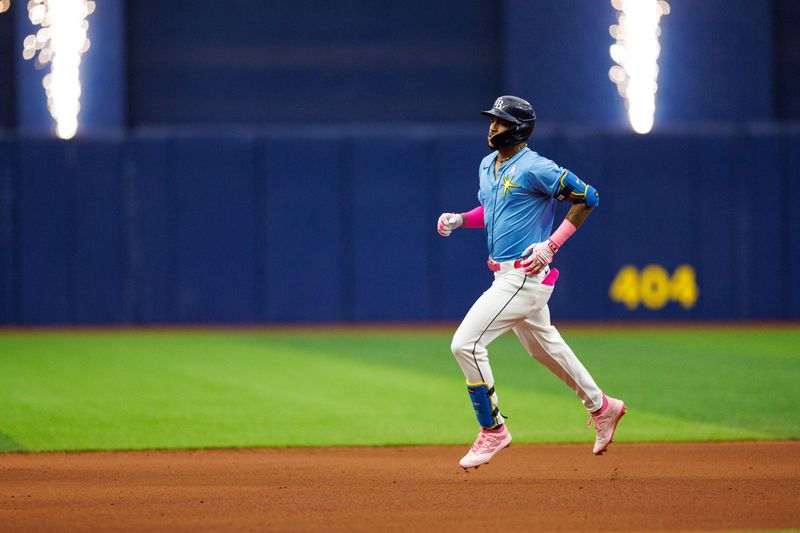 May 12, 2024; St. Petersburg, Florida, USA;  Tampa Bay Rays outfielder Jose Siri (22) runs the bases after hitting a grand slam against the New York Yankees in the seventh inning at Tropicana Field. Mandatory Credit: Nathan Ray Seebeck-USA TODAY Sports