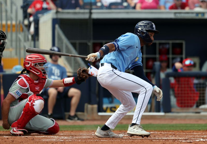 Feb 25, 2025; Port Charlotte, Florida, USA;  Tampa Bay Rays outfielder Chandler Simpson (96) singles against the Philadelphia Phillies during the third inning at Charlotte Sports Park. Mandatory Credit: Kim Klement Neitzel-Imagn Images