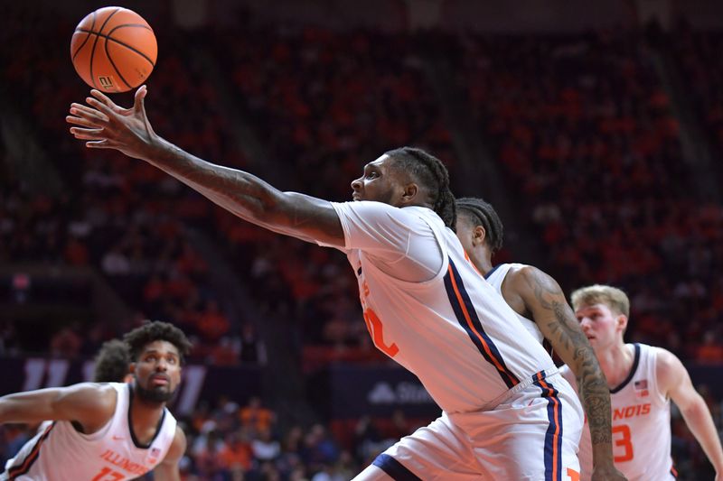 Feb 28, 2024; Champaign, Illinois, USA; Illinois Fighting Illini forward Dain Dainja (42) reaches for a rebound during the second half against the Minnesota Golden gophers at State Farm Center. Mandatory Credit: Ron Johnson-USA TODAY Sports