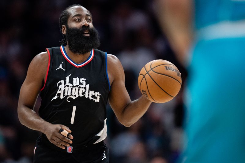 CHARLOTTE, NORTH CAROLINA - MARCH 31: James Harden #1 of the LA Clippers brings the ball up court in the first quarter during their game against the Charlotte Hornets at Spectrum Center on March 31, 2024 in Charlotte, North Carolina. NOTE TO USER: User expressly acknowledges and agrees that, by downloading and or using this photograph, User is consenting to the terms and conditions of the Getty Images License Agreement. (Photo by Jacob Kupferman/Getty Images)