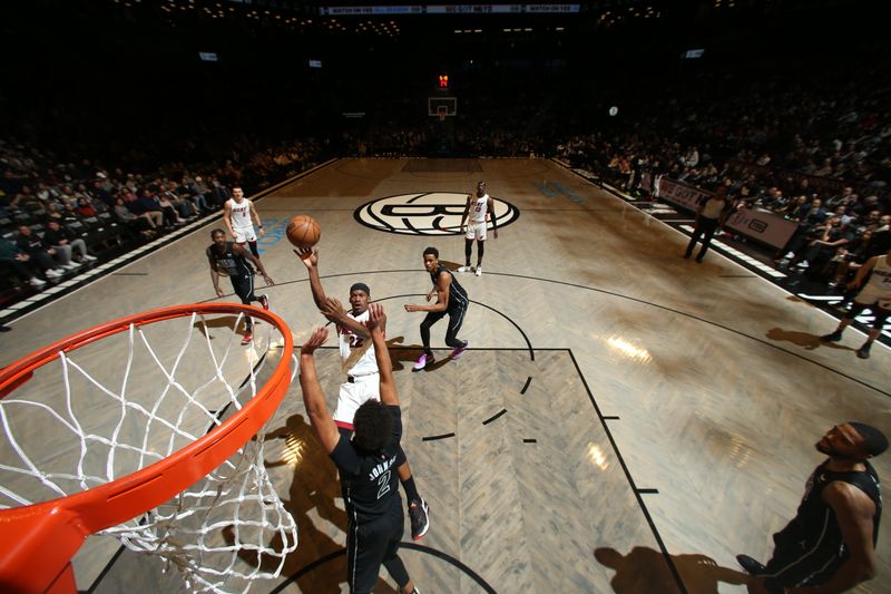 BROOKLYN, NY - JANUARY 15: Jimmy Butler #22 of the Miami Heat shoots the ball during the game against the Brooklyn Nets on January 15, 2024 at Barclays Center in Brooklyn, New York. NOTE TO USER: User expressly acknowledges and agrees that, by downloading and or using this Photograph, user is consenting to the terms and conditions of the Getty Images License Agreement. Mandatory Copyright Notice: Copyright 2024 NBAE (Photo by Nathaniel S. Butler/NBAE via Getty Images)