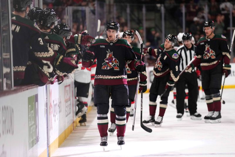 Mar 16, 2024; Tempe, Arizona, USA; Arizona Coyotes defenseman J.J. Moser (90) celebrates his goal against the New Jersey Devils during the first period at Mullett Arena. Mandatory Credit: Joe Camporeale-USA TODAY Sports