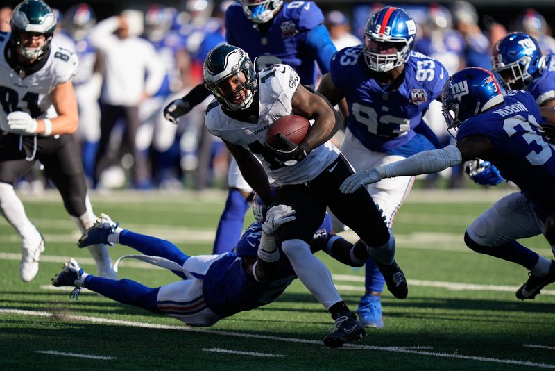 Philadelphia Eagles running back Kenneth Gainwell (14) carries the ball against the New York Giants during the fourth quarter of an NFL football game, Sunday, Oct. 20, 2024, in East Rutherford, N.J. (AP Photo/Frank Franklin II)