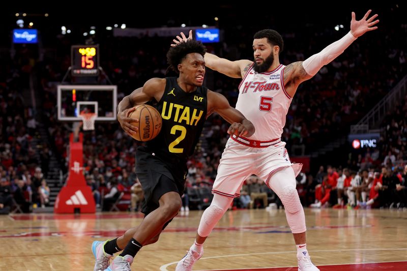 HOUSTON, TEXAS - JANUARY 20: Collin Sexton #2 of the Utah Jazz drives to the basket while defended by Fred VanVleet #5 of the Houston Rockets in the second half at Toyota Center on January 20, 2024 in Houston, Texas.  NOTE TO USER: User expressly acknowledges and agrees that, by downloading and or using this photograph, User is consenting to the terms and conditions of the Getty Images License Agreement. (Photo by Tim Warner/Getty Images)