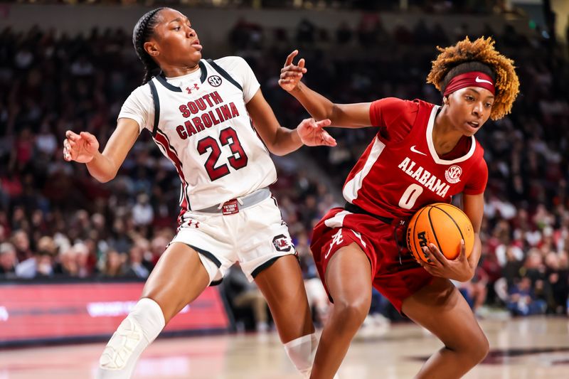 Feb 22, 2024; Columbia, South Carolina, USA; South Carolina Gamecocks guard Bree Hall (23) and Alabama Crimson Tide guard Loyal McQueen (0) collide in the second half at Colonial Life Arena. Mandatory Credit: Jeff Blake-USA TODAY Sports