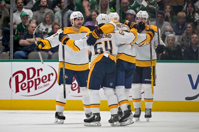 Oct 15, 2022; Dallas, Texas, USA; Nashville Predators left wing Filip Forsberg (9) and center Mikael Granlund (64) and right wing Nino Niederreiter (22) and center Ryan Johansen (92) celebrates a goal scored by Niederreiter against the Dallas Stars during the second period at the American Airlines Center. Mandatory Credit: Jerome Miron-USA TODAY Sports