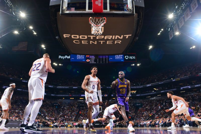 PHOENIX, AZ - OCTOBER 28: Ryan Dunn #0 of the Phoenix Suns celebrates during the game against the Los Angeles Lakers on October 28, 2024 at Footprint Center in Phoenix, Arizona. NOTE TO USER: User expressly acknowledges and agrees that, by downloading and or using this photograph, user is consenting to the terms and conditions of the Getty Images License Agreement. Mandatory Copyright Notice: Copyright 2024 NBAE (Photo by Kate Frese/NBAE via Getty Images)