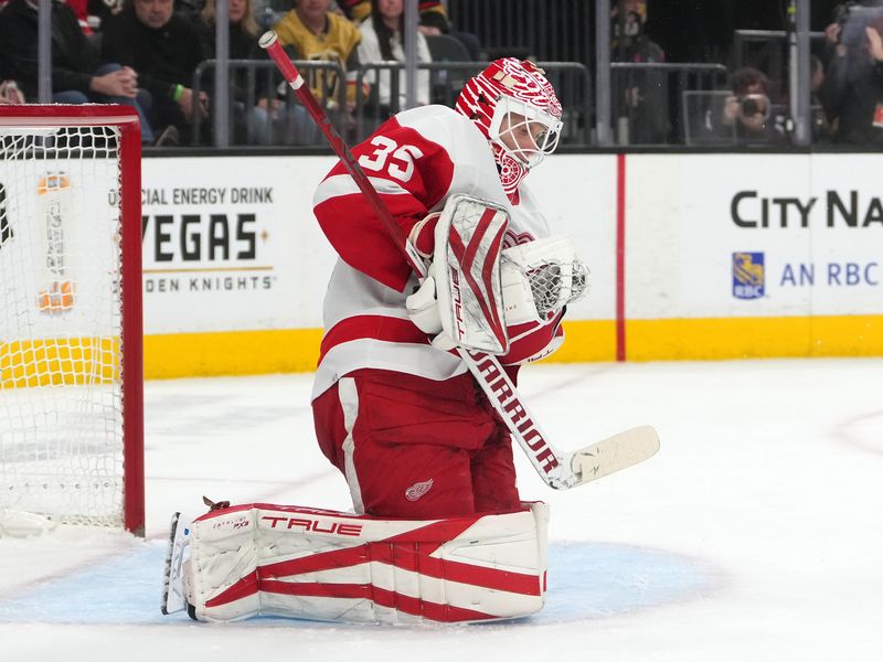 Jan 19, 2023; Las Vegas, Nevada, USA; Detroit Red Wings goaltender Ville Husso (35) stops a shot by the Vegas Golden Knights during the second period at T-Mobile Arena. Mandatory Credit: Stephen R. Sylvanie-USA TODAY Sports