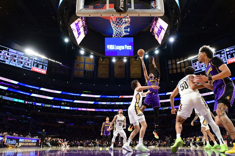 LOS ANGELES, CA - FEBRUARY 9:  Christian Wood #35 of the Los Angeles Lakers drives to the basket during the game against the New Orleans Pelicans on February 9, 2024 at Crypto.Com Arena in Los Angeles, California. NOTE TO USER: User expressly acknowledges and agrees that, by downloading and/or using this Photograph, user is consenting to the terms and conditions of the Getty Images License Agreement. Mandatory Copyright Notice: Copyright 2024 NBAE (Photo by Adam Pantozzi/NBAE via Getty Images)