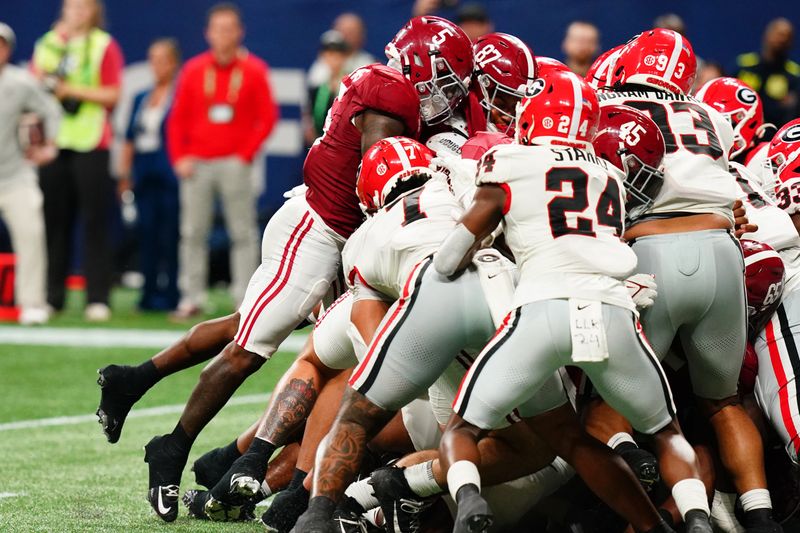 Dec 2, 2023; Atlanta, GA, USA; Alabama Crimson Tide running back Roydell Williams (5) dives for a touchdown against the Georgia Bulldogs in the fourth quarter of the SEC Championship at Mercedes-Benz Stadium. Mandatory Credit: John David Mercer-USA TODAY Sports