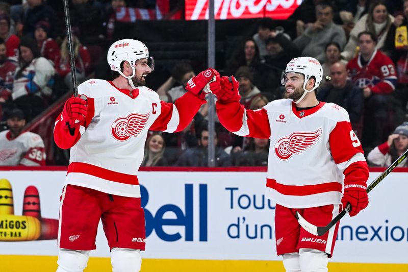 Jan 10, 2026; Montreal, Quebec, CAN; Detroit Red Wings center Dylan Larkin (71) celebrates with right wing Alex DeBrincat (93) his goal against the Montreal Canadiens during the second period at Bell Centre. Mandatory Credit: David Kirouac-Imagn Images