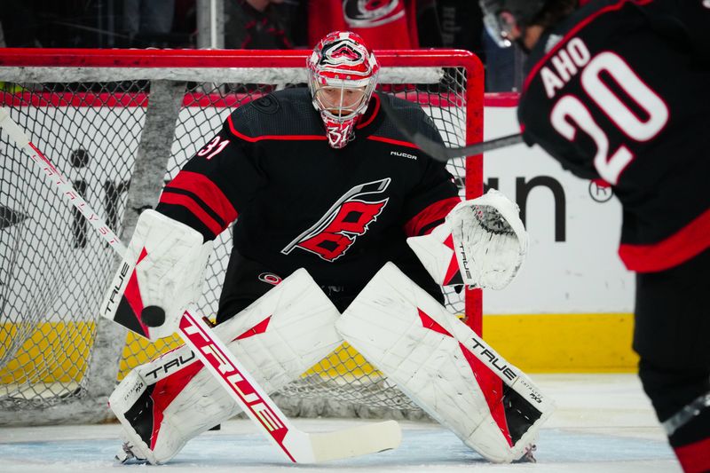 Mar 14, 2024; Raleigh, North Carolina, USA; Carolina Hurricanes goaltender Frederik Andersen (31) watches the shot during the warmups before the game against the Florida Panthers at PNC Arena. Mandatory Credit: James Guillory-USA TODAY Sports