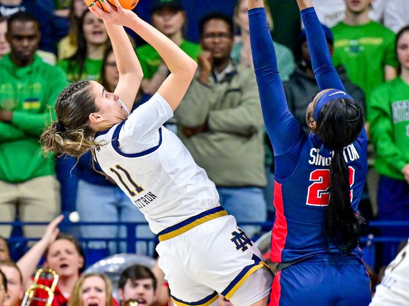 Mar 25, 2024; South Bend, Indiana, USA; Notre Dame Fighting Irish guard Sonia Citron (11) goes up for a shot as Ole Miss Rebels forward Tyia Singleton (22) defends in the second half of the NCAA Tournament second round game at the Purcell Pavilion. Mandatory Credit: Matt Cashore-USA TODAY Sports