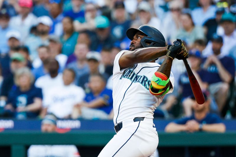 Jun 30, 2025; Seattle, Washington, USA; Seattle Mariners left fielder Randy Arozarena (56) hits a three-run home run against the Kansas City Royals during the fifth inning at T-Mobile Park. Mandatory Credit: Joe Nicholson-Imagn Images