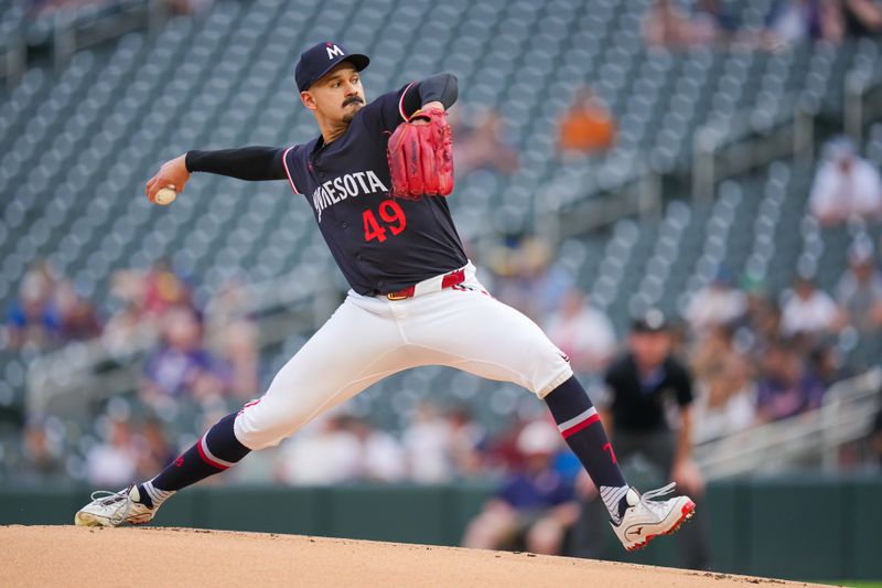 Jun 18, 2024; Minneapolis, Minnesota, USA; Minnesota Twins pitcher Pablo López (49) pitches against the Tampa Bay Rays in the first inning at Target Field. Mandatory Credit: Brad Rempel-USA TODAY Sports