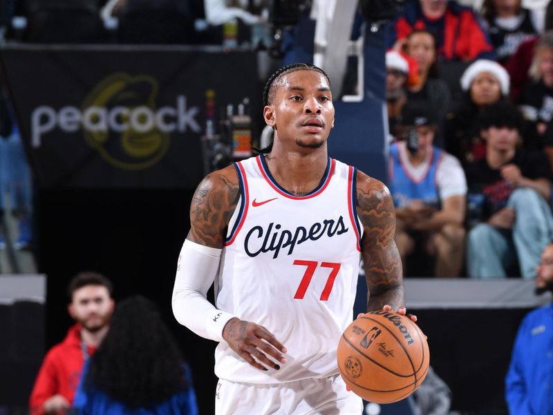 INGLEWOOD, CA - DECEMBER 8: Kevin Porter Jr. #77 of the LA Clippers dribbles the ball during the game against the Houston Rockets on December 8, 2024 at Intuit Dome in Los Angeles, California. NOTE TO USER: User expressly acknowledges and agrees that, by downloading and/or using this Photograph, user is consenting to the terms and conditions of the Getty Images License Agreement. Mandatory Copyright Notice: Copyright 2024 NBAE (Photo by Juan Ocampo/NBAE via Getty Images)